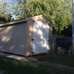 Shed placed right up against fence
